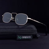 Sunglasses with a black case on a dark background, featuring the Sunglassl brand.