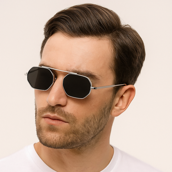 Man wearing sunglasses with a plain background