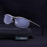 Sunglasses with a black case on a dark background, featuring the Sunglassic brand.