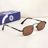 Sunglasses with brown lenses and black frames on a white surface with a blue box in the background.