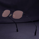 Sunglasses with brown lenses and black frame on a dark background
