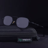 Sunglasses with a black case on a dark background