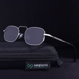 Sunglasses on a black textured surface with 'Sunglassic' branding.